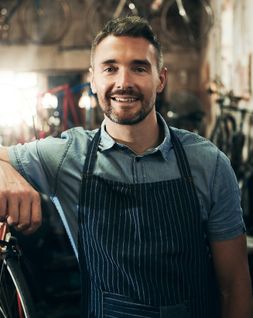 bike shop owner using our business plan template