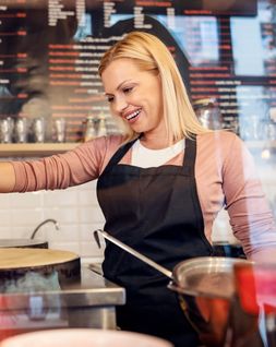 creperie owner using our business plan template