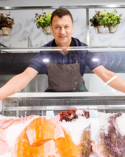 fishmonger owner using our business plan template