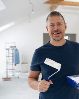 painting company owner using our business plan template