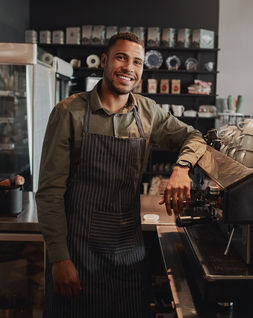 coffee shop owner using our business plan template