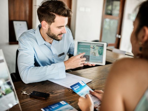 beach resort business plan honeymoon resort business plan: businesswoman taking bookings