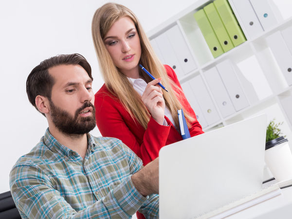 entrepreneur showing his business plan to a cofounder or business partner