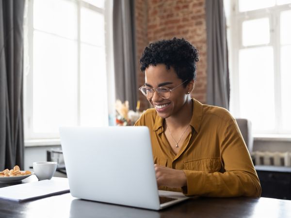 entrepreneur writing their internal plan for their business and staffing team using an online software