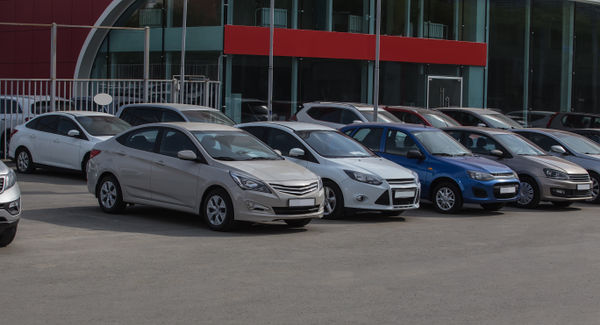 a range of cars, each one displayed pristinely: illustration for the products and services section of the business plan